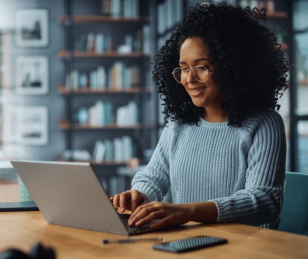 woman of color using laptop