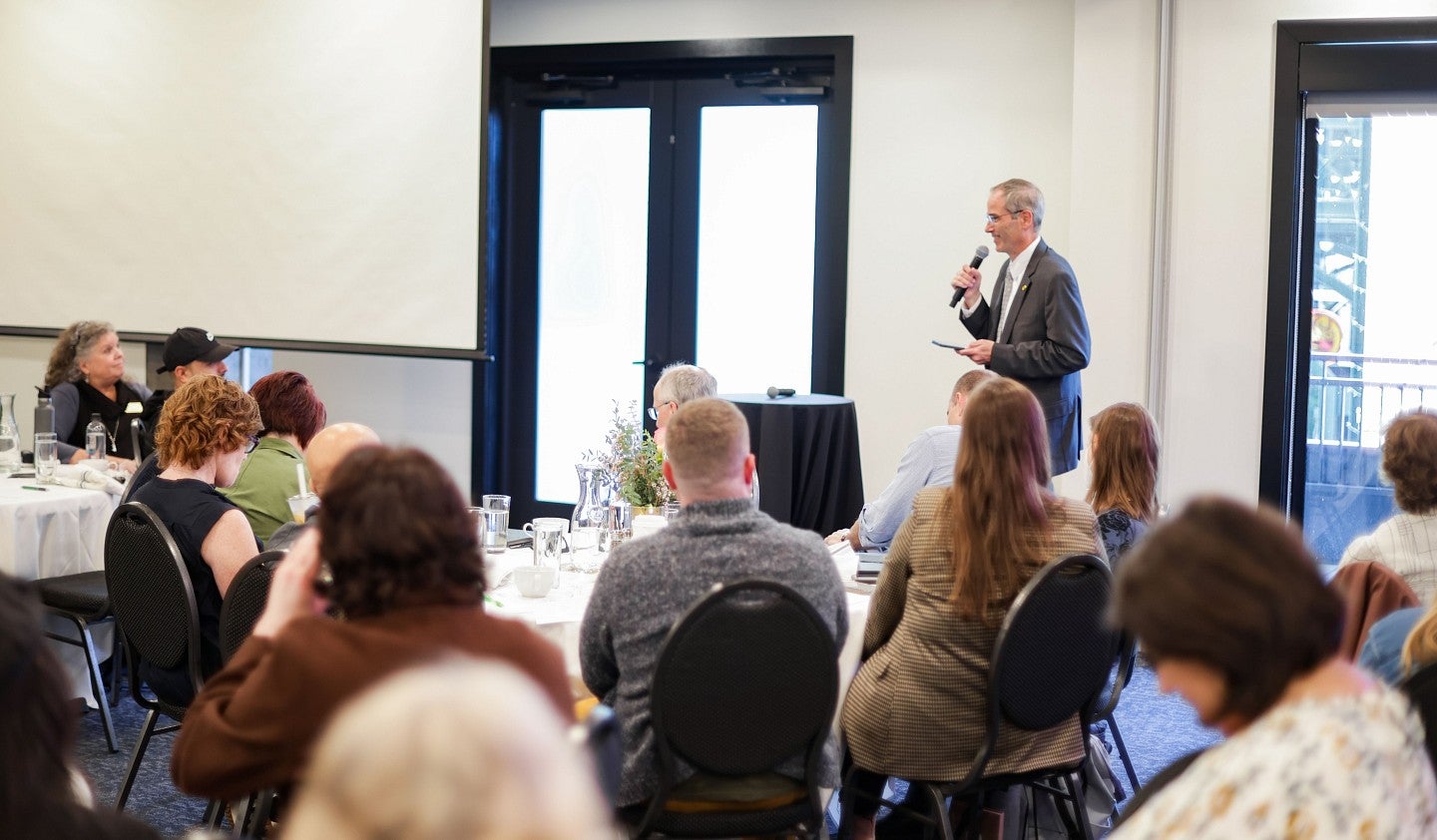 Provost Chris Long speaks to SOJC faculty and staff