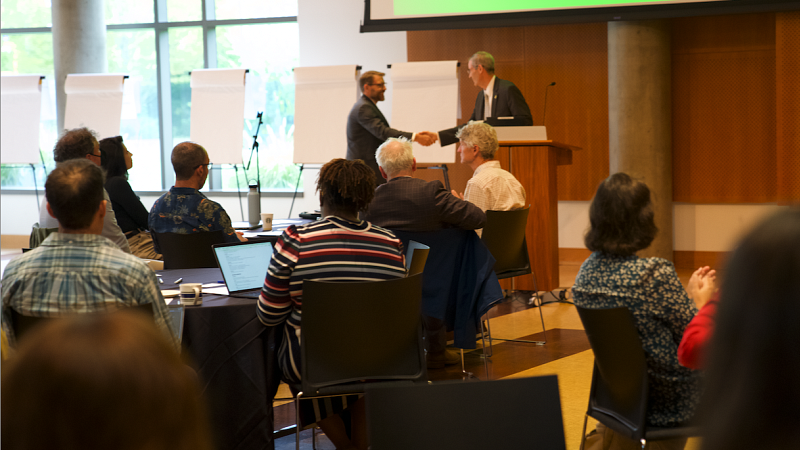 Provost Chris Long speaks with deans from the College of Arts and Sciences