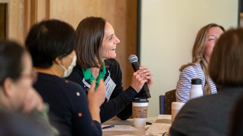 UO Leadership Academy student with microphone