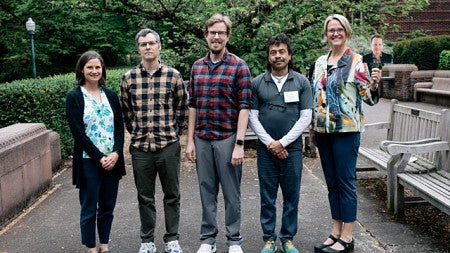 5 participants standing in a line looking forward
