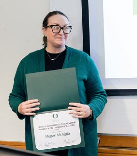 megan mcalpin holding distinguished teaching award