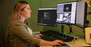 person on computer
