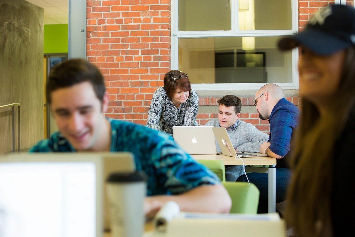 Deb Morrison with students in Allen Hall