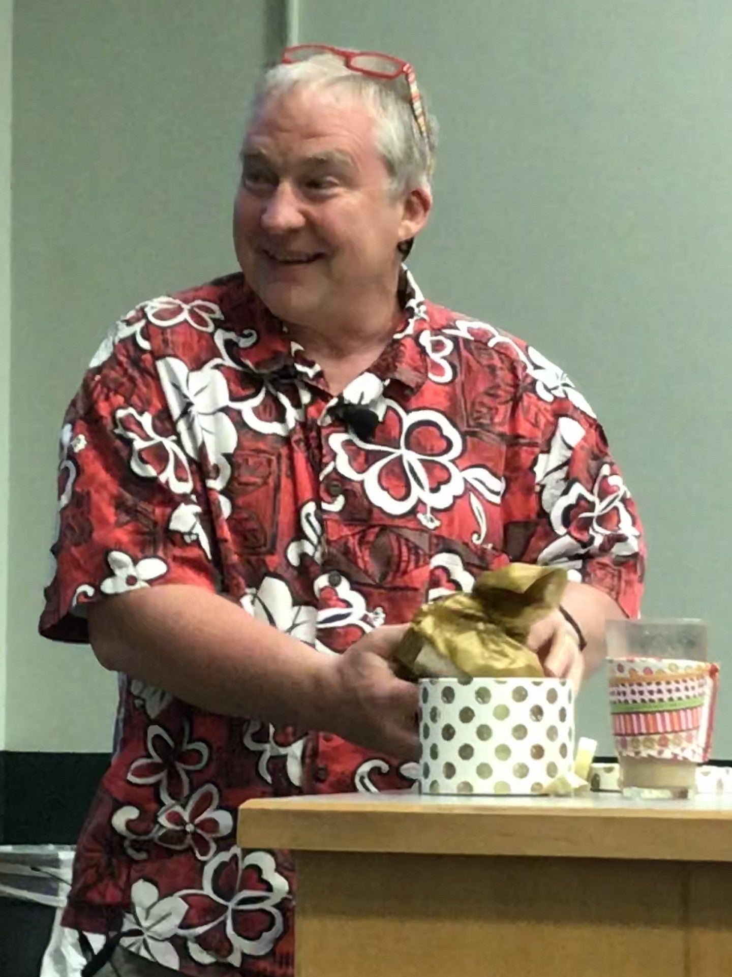 Mark Carrier opens a gift box