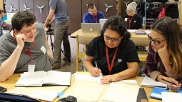 Photo of Native American students around table